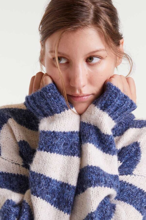 Knitted sweater with white and purple stripes